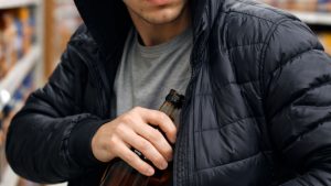 Close up of a man shoplifting in a store
